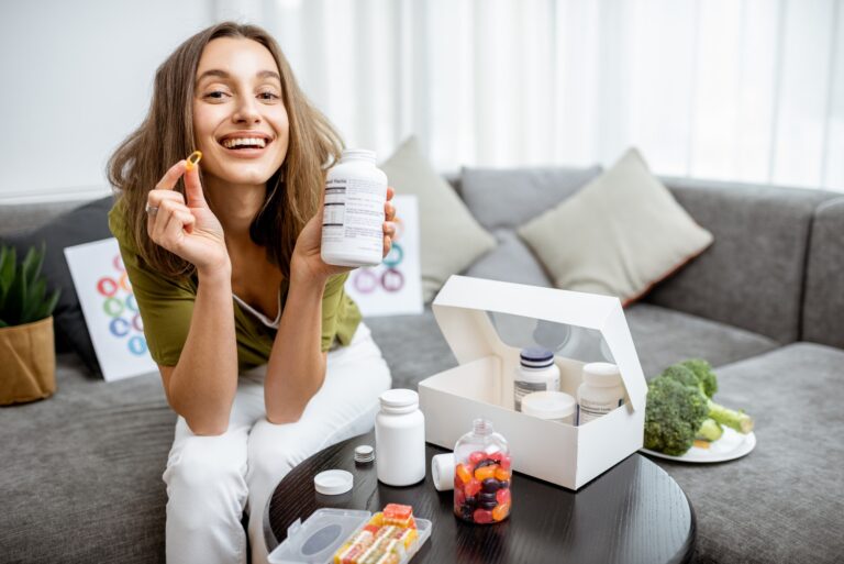 Woman with nutritional supplements at home